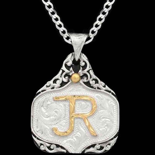 Unveil the Holmer Cow Tag Necklace adorned with intrincate silver scrollwork with your ranch brand or custom logo highlighted in Jeweler's Bronze. Pair it with a special discount sterling silver chain! 